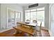 Charming dining area bathed in natural light, featuring a wooden table and bench seating at 114 Wingard Rd, Concord, NC 28025