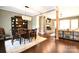 Open dining room with elegant light fixture, built-in shelving, and seamless flow to the living area at 114 Wingard Rd, Concord, NC 28025