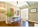 Inviting foyer with hardwood floors, decorative lighting, and a welcoming entrance at 114 Wingard Rd, Concord, NC 28025