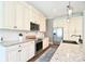 Well-equipped kitchen featuring granite countertops, stainless steel appliances, and custom cabinetry at 114 Wingard Rd, Concord, NC 28025