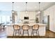 Modern kitchen with a large island, pendant lighting, granite countertops, and breakfast bar seating at 114 Wingard Rd, Concord, NC 28025