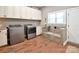 Laundry Room including a dog bath with tile surround, washer, dryer and storage at 114 Wingard Rd, Concord, NC 28025