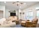 Comfortable living room featuring a neutral sofa, accent chair, and a large window for natural light at 114 Wingard Rd, Concord, NC 28025