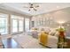 Comfortable living room featuring hardwood floors, ceiling fan, and plenty of natural light at 114 Wingard Rd, Concord, NC 28025