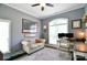 Comfortable home office area featuring a stylish desk, love seat, and soft, patterned rug, ideal for work or relaxation at 114 Wingard Rd, Concord, NC 28025