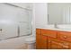 Neutral bathroom with vanity and shower-tub combo with sliding glass door at 11863 Ridgeway Park Dr, Charlotte, NC 28277