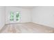This bedroom features neutral carpet and a glass door to the patio at 11863 Ridgeway Park Dr, Charlotte, NC 28277
