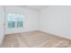 Bright bedroom with neutral walls, carpet and window with blinds at 11863 Ridgeway Park Dr, Charlotte, NC 28277