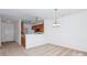 Open dining room with neutral carpet near kitchen area and front door at 11863 Ridgeway Park Dr, Charlotte, NC 28277