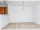 Inviting dining room with neutral carpet and modern hanging light fixture at 11863 Ridgeway Park Dr, Charlotte, NC 28277