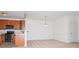 Open dining room with neutral carpet located near a stainless steel kitchen at 11863 Ridgeway Park Dr, Charlotte, NC 28277