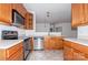Open kitchen featuring stainless steel appliances and light cabinetry at 11863 Ridgeway Park Dr, Charlotte, NC 28277