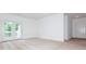 A bright living room with neutral walls, carpet and balcony access at 11863 Ridgeway Park Dr, Charlotte, NC 28277