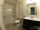 Bathroom with a vanity, toilet, and a shower-tub combo with tile surround at 120 Mooring Dr, Statesville, NC 28677