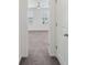 Spacious bedroom with neutral carpet, two sunny windows, and ceiling fan at 120 Mooring Dr, Statesville, NC 28677