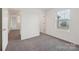 Neutral bedroom features carpet flooring, window, and natural light at 120 Mooring Dr, Statesville, NC 28677