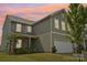 Two-story home featuring a two-car garage, covered porch, and well-maintained lawn at 120 Mooring Dr, Statesville, NC 28677