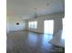Bright living room featuring hard surface floors and sliding doors to a patio at 120 Mooring Dr, Statesville, NC 28677