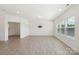 Bright living room with light wood floors, recessed lighting, and large windows at 120 Mooring Dr, Statesville, NC 28677