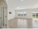 Bright living room with wood floors and large windows at 120 Mooring Dr, Statesville, NC 28677