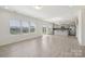Open floor plan with living room and kitchen, light wood floors, and modern lighting at 120 Mooring Dr, Statesville, NC 28677