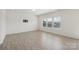 Bright living room with light wood floors, recessed lighting, and three windows at 120 Mooring Dr, Statesville, NC 28677