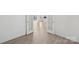 Bright office space with open french doors, view to the hall, and wood-look floors at 120 Mooring Dr, Statesville, NC 28677