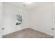 Bright home office with modern wood-look flooring and a view to the neighborhood at 120 Mooring Dr, Statesville, NC 28677
