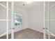 Bright office space features wood-look floors and french doors for a professional, private area at 120 Mooring Dr, Statesville, NC 28677