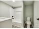 Bathroom featuring a white vanity, tub and shower combo with white tile, and a matching white toilet at 1224 Martin Rd, Hickory Grove, SC 29717