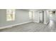 Bedroom showcasing updated flooring, a bright window, and a spacious closet, complemented by neutral paint at 1224 Martin Rd, Hickory Grove, SC 29717
