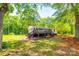 Charming single-story home with a large deck surrounded by lush greenery and mature trees at 1224 Martin Rd, Hickory Grove, SC 29717