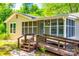Inviting home with a ramp leading to a screened porch, offering a comfortable entrance at 1224 Martin Rd, Hickory Grove, SC 29717
