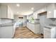 Newly renovated kitchen boasts white cabinetry, granite countertops, and modern appliances at 1224 Martin Rd, Hickory Grove, SC 29717