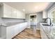 Beautiful kitchen featuring granite countertops and white cabinetry, new flooring at 1224 Martin Rd, Hickory Grove, SC 29717