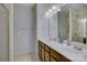 Double sink bathroom with separated rooms for the commode and shower at 1225 Assembly St, Belmont, NC 28012