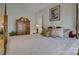 Bedroom with a four-poster bed, wooden dresser, soft lighting, and cozy decor at 1225 Assembly St, Belmont, NC 28012