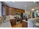 Kitchen with stainless steel appliances, granite countertops, and wood cabinets at 1225 Assembly St, Belmont, NC 28012