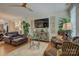 Comfortable living room featuring hardwood floors, a ceiling fan, and stylish decor at 1225 Assembly St, Belmont, NC 28012