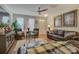 Inviting living room featuring hardwood floors, stylish seating, and sophisticated decor at 1225 Assembly St, Belmont, NC 28012