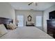 Bright main bedroom includes queen size bed, ceiling fan, and side tables at 1225 Assembly St, Belmont, NC 28012