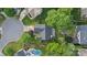 Aerial view of a home featuring a backyard pool, lush landscaping, and a private outdoor space at 1310 Bellhook Nw Pl, Concord, NC 28027