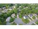 Neighborhood aerial showcasing mature trees, well-maintained homes, and serene cul-de-sac streets at 1310 Bellhook Nw Pl, Concord, NC 28027