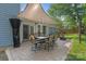 Backyard patio featuring an outdoor dining set and shade covering, perfect for entertaining at 1310 Bellhook Nw Pl, Concord, NC 28027