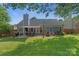 Spacious backyard with a patio area, perfect for outdoor dining and entertaining at 1310 Bellhook Nw Pl, Concord, NC 28027