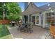 Backyard patio with outdoor dining set and grill, perfect for entertaining at 1310 Bellhook Nw Pl, Concord, NC 28027