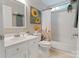 Neutral bathroom featuring a single sink vanity and a shower-tub combo at 1310 Bellhook Nw Pl, Concord, NC 28027