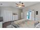Spacious bedroom with large closet, neutral walls, and plush bedding for a relaxing retreat at 1310 Bellhook Nw Pl, Concord, NC 28027