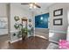 Inviting living room with hardwood floors, neutral paint, and ample space for furnishings at 1310 Bellhook Nw Pl, Concord, NC 28027