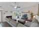 Inviting living room with a fireplace, ceiling fan, and a comfortable sectional sofa at 1310 Bellhook Nw Pl, Concord, NC 28027